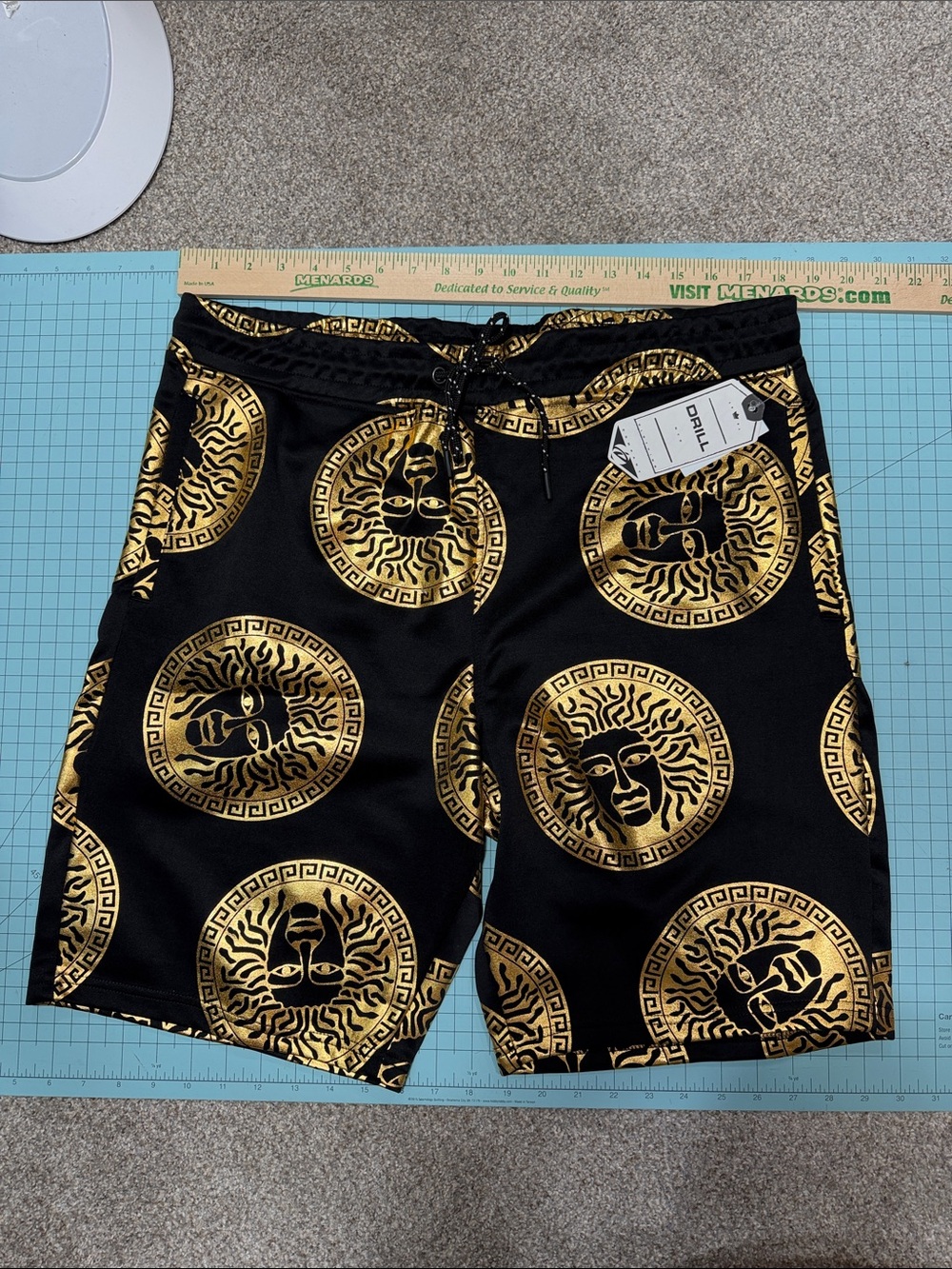 Men's Black Athletic Shorts with Gold Medallion Print